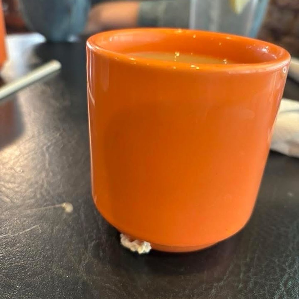 Used chewing gum on coffee cup Used chewing gum on coffee cup