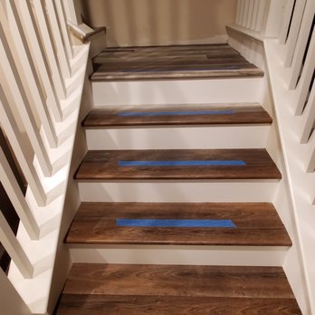 NP Flooring - a close up view of a staircase - Flooring Near Me