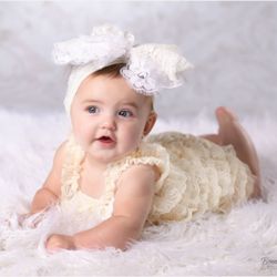 Bonnie Wright Photography - One year old in a fancy outfit with a big bow