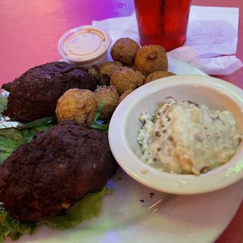 A-J's Dockside Restaurant - Deviled crab before served on tin foil with refrigerator cold hush puppies - Seafood Near Me - Tybee Island, Georgia A-J's Dockside Restaurant - Deviled crab before served on tin foil with refrigerator cold hush puppies - Seafood Near Me - Tybee Island, Georgia