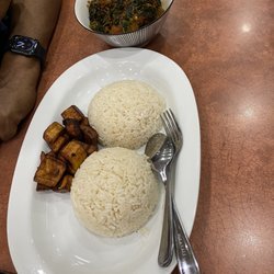 Efo riro with rice and plantain