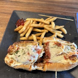 Chicken Parmigiana Hero and fries Chicken Parmigiana Hero and fries