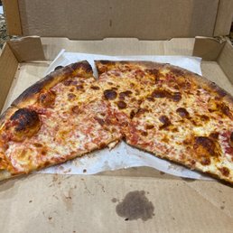 a half eaten pizza in a box