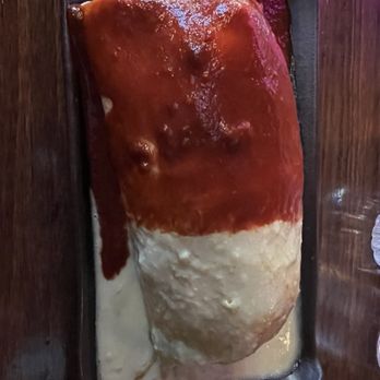 Wet burrito with both sauces and shrimp on the inside. Came with a side salad which had pre mixed in dressing.