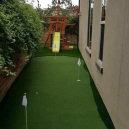 Top of the line putting green with LED lights in the holes Top of the line putting green with LED lights in the holes