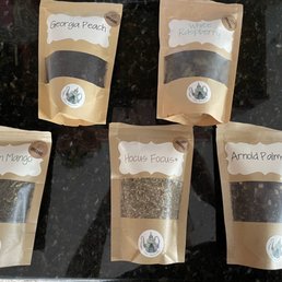 four bags of tea on a counter four bags of tea on a counter