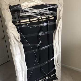 Franklin Ma Junk Removal - Sofa Bed wrapped and ready to be loaded on to truck. - Movers Near Me - Franklin, Massachusetts