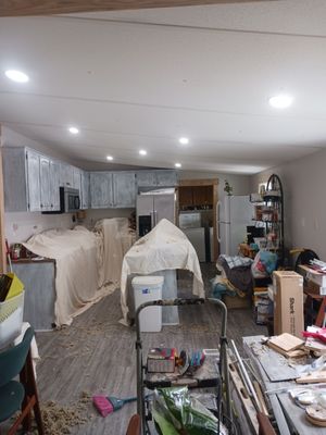 Remodeling a double wide... - I remodeled this whole home from one side to the other. I put can lights in. I ran electrical. I white washed cabinets, I done half and half on walls that the client wanted done. put flooring in. hung ceiling fans, built custom cabinets, boxed the entry ways off, built customized doors ect.. Remodeling a double wide... - I remodeled this whole home from one side to the other. I put can lights in. I ran electrical. I white washed cabinets, I done half and half on walls that the client wanted done. put flooring in. hung ceiling fans, built custom cabinets, boxed the entry ways off, built customized doors ect..