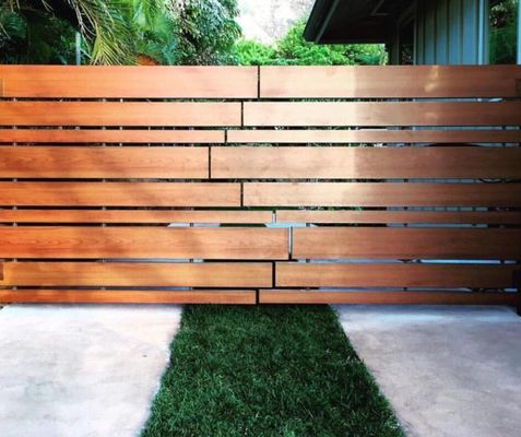 Photo of Defensible Designs - Orinda, CA, US. Sample of "Knotwood" aluminum product on a fence