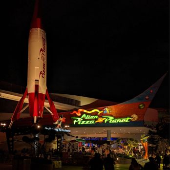 Alien Pizza Planet - So much cooler with the lighting at night time, around 8:20 it was a 5-10 minute turnaround for food. - Pizza Near Me - Anaheim, California