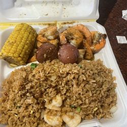 Old Miss - Lunch plate seafood and rice w/ ole miss seafood sauce over the top  $10.00