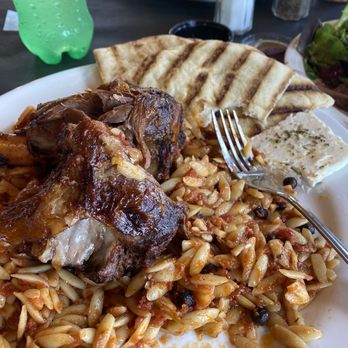 Greek Cafe Restaurant - Lamb Shank with orzo ,tomato sauce and peppercorns. - Mediterranean Near Me - Riceville, Tennessee Greek Cafe Restaurant - Lamb Shank with orzo ,tomato sauce and peppercorns. - Mediterranean Near Me - Riceville, Tennessee