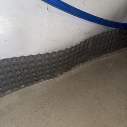 French drain complete and dry even after heavy downpour.  Not a drop of water in sight!