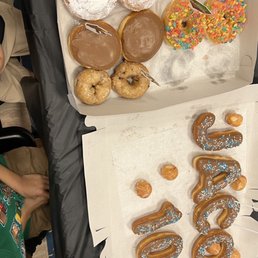 Powdered with lemon filling, chocolate glaze with custard filling, blueberry, glaze with fruity pebbles, small apple fritter Powdered with lemon filling, chocolate glaze with custard filling, blueberry, glaze with fruity pebbles, small apple fritter