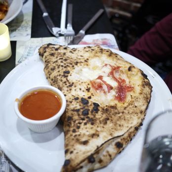 il Canale - CALZONE - Organic flour, stuffed with imported Buffalo mozzarella, ham, ricotta, basil served with a side of marinara sauce - Italian Near Me - Washington, DC, District of Columbia