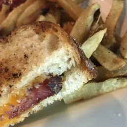 The Grilled Cheese on special - filled with cheddar, German sausage and red onions. Side of fries, make sure to ask for the jalapeño aioli!! The Grilled Cheese on special - filled with cheddar, German sausage and red onions. Side of fries, make sure to ask for the jalapeño aioli!!