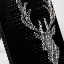 Reflection Art Studio - String Art: Hammer nails around a stencil to create a shape. Then attach string and thread it around the nails to create your masterpiece.
