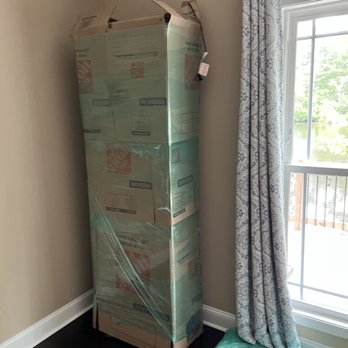 Movers United - Grandfather clock wrapped and ready for loading - Movers Near Me