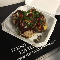 Restoration Barbecue - Hungry? Our monster potato not only takes a 1lb potato, but adds a pound of meat and all the fixins! This spud isn't for the faint of heart!