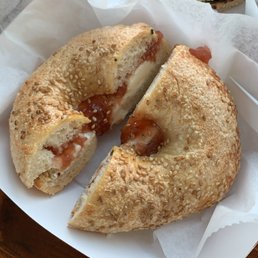 Sesame bagel with cream cheese and strawberry jelly Sesame bagel with cream cheese and strawberry jelly