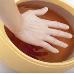 Paraffin hand dip with massage. Helps restore moisture and remove dry skin.