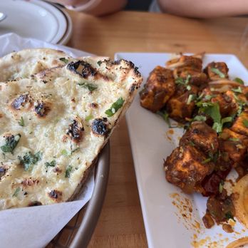 Spice Grove Indian Cuisine - Garlic Naan and Ghee Roast Dosa (so spicy!) - Indian Near Me - The Colony, Texas Spice Grove Indian Cuisine - Garlic Naan and Ghee Roast Dosa (so spicy!) - Indian Near Me - The Colony, Texas