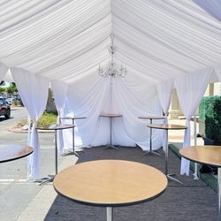 Maggies Party Rentals - 10x20 tent with tables and upgraded draping