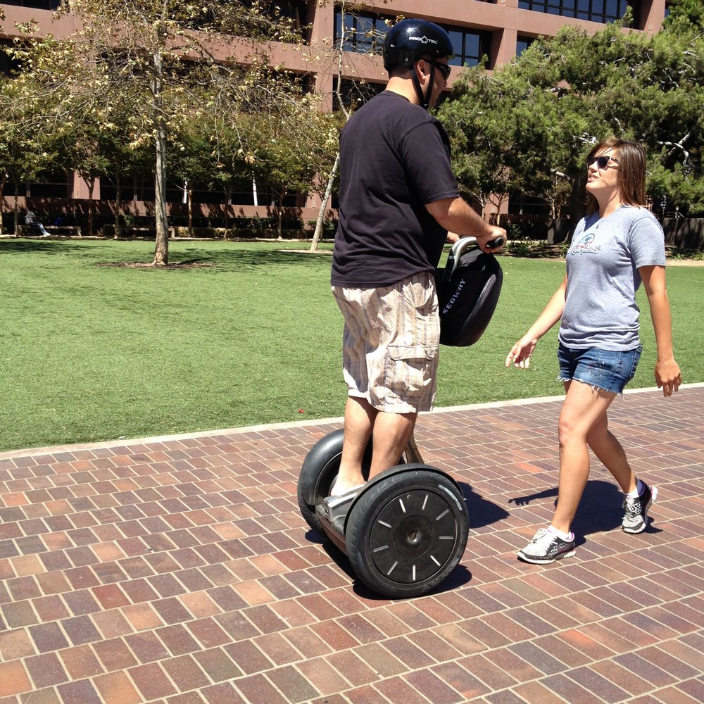 We Love Tourists - Bridgette teaching one of my coworkers how to ride - Walking Tours Near Me - La Jolla, California We Love Tourists - Bridgette teaching one of my coworkers how to ride - Walking Tours Near Me - La Jolla, California