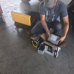 Kevin taking my new Kenwood stereo out of the factory box. Kevin taking my new Kenwood stereo out of the factory box.