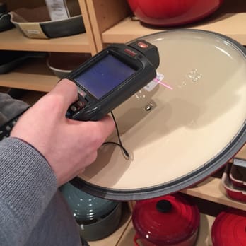 Williams-Sonoma - a person using a handheld scanner to scan a pan - Specialty Food Near Me - Leawood, Kansas Williams-Sonoma - a person using a handheld scanner to scan a pan - Specialty Food Near Me - Leawood, Kansas