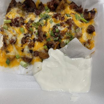 Smokehouse Barbecue - Independence - KC Potato Skins with roaming sour cream. - Barbeque Near Me - Independence, Missouri Smokehouse Barbecue - Independence - KC Potato Skins with roaming sour cream. - Barbeque Near Me - Independence, Missouri