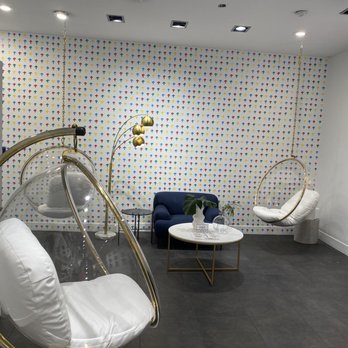 Players Cafe - a living room with a swing chair and a coffee table - Cafes Near Me - New York, New York Players Cafe - a living room with a swing chair and a coffee table - Cafes Near Me - New York, New York