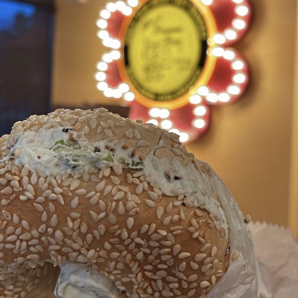 Sesame bagel with scallion cream cheese Sesame bagel with scallion cream cheese