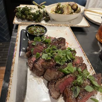 Broken Spirits-Anaheim - Prime New York Steak! Sides are brussels sprouts and broccolini - Cocktail Bars Near Me - Anaheim, California Broken Spirits-Anaheim - Prime New York Steak! Sides are brussels sprouts and broccolini - Cocktail Bars Near Me - Anaheim, California