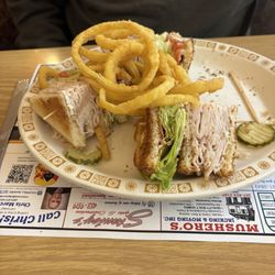 The Villager Family Restaurant - Turkey club sandwich with onion rings