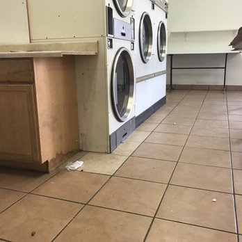 Sun City Cleaners - Dirty floor and machines - Laundry Services Near Me - Sun City, Arizona