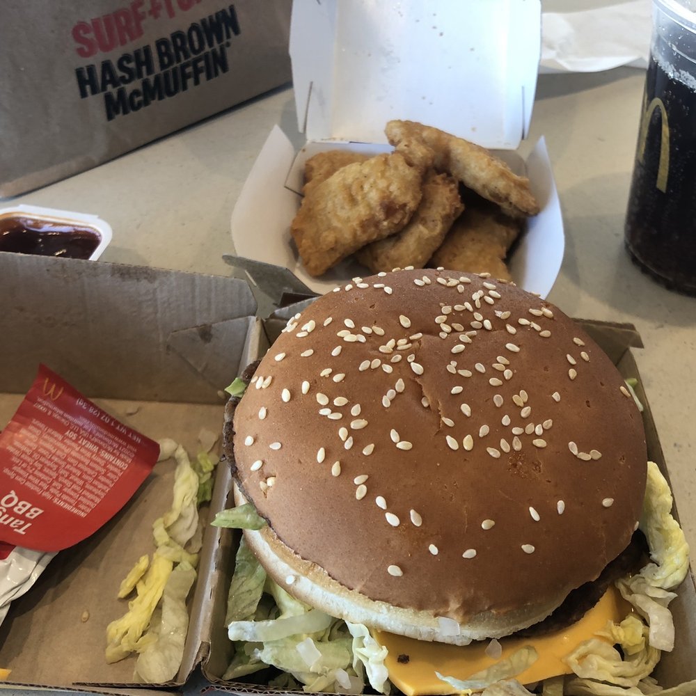 a hamburger and fries in a box