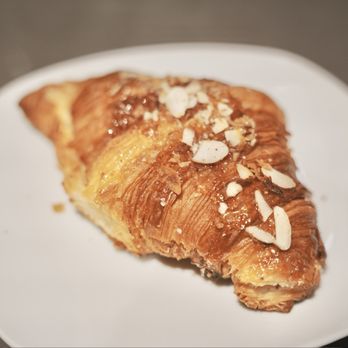 Chaupain Bakery - Almond Croissant. Rich almond paste inside a flakey croissant with a snowy dusting of powdered sugar. - Breakfast & Brunch Near Me - Laguna Niguel, California Chaupain Bakery - Almond Croissant. Rich almond paste inside a flakey croissant with a snowy dusting of powdered sugar. - Breakfast & Brunch Near Me - Laguna Niguel, California