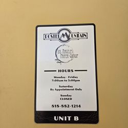 Los Angeles Paper Group - Signage on entrance door listing hours of operation.