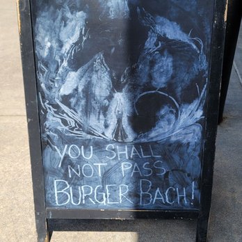 Burger Bach - a chalkboard sign on a sidewalk - Burgers Near Me - Charlottesville, Virginia Burger Bach - a chalkboard sign on a sidewalk - Burgers Near Me - Charlottesville, Virginia