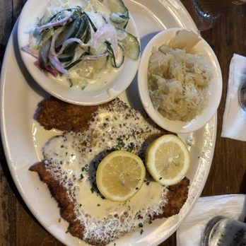 Cafe Rustika - Rhamschnitzle with cucumber salad and sauerkraut. - German Near Me - Richmond, Virginia Cafe Rustika - Rhamschnitzle with cucumber salad and sauerkraut. - German Near Me - Richmond, Virginia