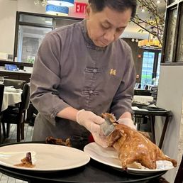 Chef carving the duck Chef carving the duck