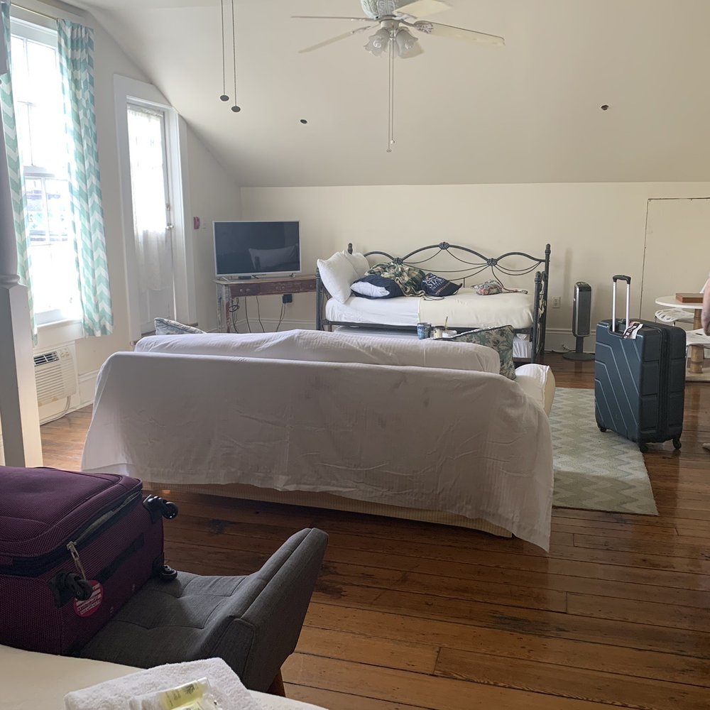 From bed to "living room" showing couch and daybed with trundle. Private entrance to courtyard and balcony on left From bed to "living room" showing couch and daybed with trundle. Private entrance to courtyard and balcony on left