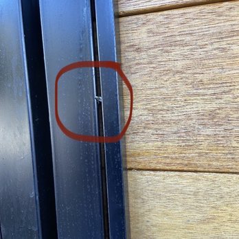 Image Outdoor - After replacing the wood panels to match the gate door, screws were sticking out and visible, bending metal frame - Fences & Gates Near Me Image Outdoor - After replacing the wood panels to match the gate door, screws were sticking out and visible, bending metal frame - Fences & Gates Near Me