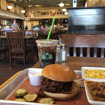 Joe's Real BBQ - This is the view from the table by the window to the right of the entry way door. - Barbeque Near Me - Gilbert, Arizona