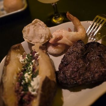 The Butterscotch Den - Chef's Kiss! Baked Potato, Dinner Roll with Sweet Whipped Butter, Steamed Prawns and half of a 12oz Ribeye - Steakhouses Near Me - Sacramento, California The Butterscotch Den - Chef's Kiss! Baked Potato, Dinner Roll with Sweet Whipped Butter, Steamed Prawns and half of a 12oz Ribeye - Steakhouses Near Me - Sacramento, California