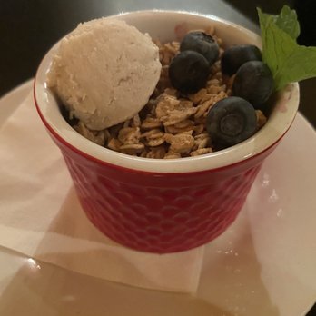 The Tasteful Kitchen - Hot baked cobbler topped with granola blueberries and coconut ice cream. - Vegetarian Near Me The Tasteful Kitchen - Hot baked cobbler topped with granola blueberries and coconut ice cream. - Vegetarian Near Me