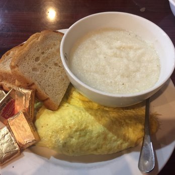 Cafe Soleil - Bacon and cheddar cheese omelette with rye toast. I ordered grits on the side. - Breakfast & Brunch Near Me - El Sobrante, California Cafe Soleil - Bacon and cheddar cheese omelette with rye toast. I ordered grits on the side. - Breakfast & Brunch Near Me - El Sobrante, California