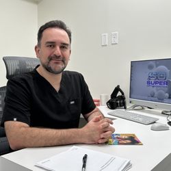 Super Orthodontics - Dr. Amir Assefnia in his office
