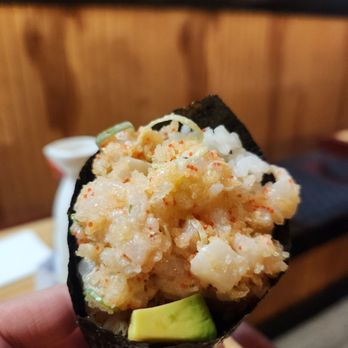 Koiso Japanese Restaurant - a hand holding a piece of sushi - Japanese Near Me - Carle Place, New York Koiso Japanese Restaurant - a hand holding a piece of sushi - Japanese Near Me - Carle Place, New York
